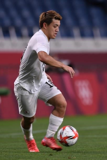 Ritsu Doan of Japan dribbles the ball during the Men's 3rd place match between Mexico and Japan on Day 14 of the Tokyo 2020 Olympic Games at Saitama...