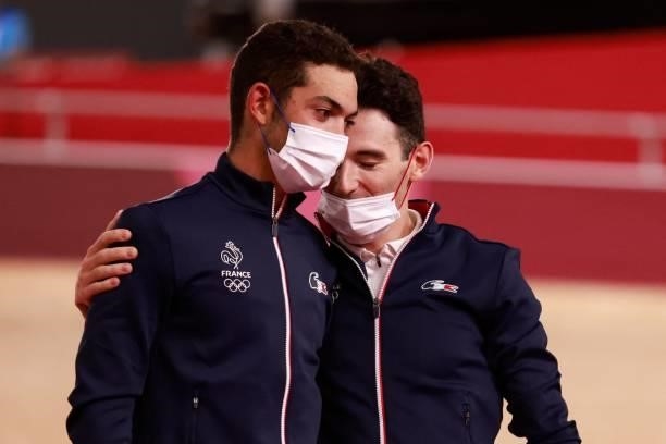 Bronze medallists France's Benjamin Thomas and France's Donavan Grondin celebrate on podium during the medals ceremony for the men's track cycling...