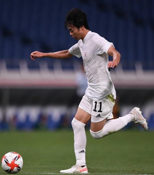 Kaoru Mitoma of Japan dribbles the ball during the 3rd place match of the Men's Football between Mexico and Japan on Day 14 of the Tokyo 2020 Olympic...