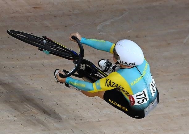 Kazakhstan's Sergey Ponomaryov crashes in the men's track cycling keirin first round heats during the Tokyo 2020 Olympic Games at Izu Velodrome in...