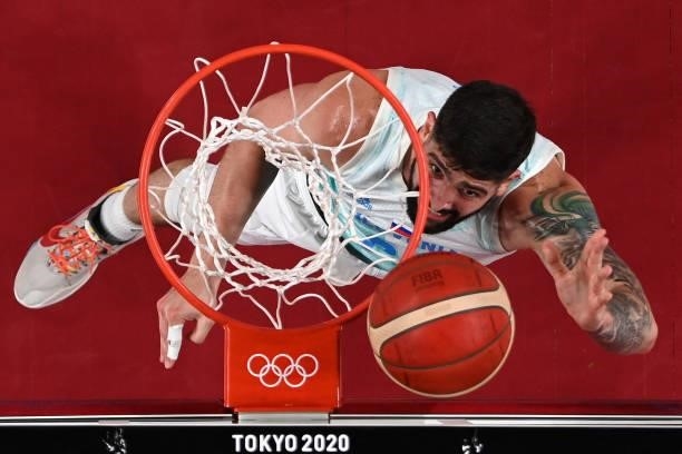 Slovenia's Ziga Dimec goes to the basket in the men's bronze medal basketball match between Slovenia and Australia during the Tokyo 2020 Olympic...