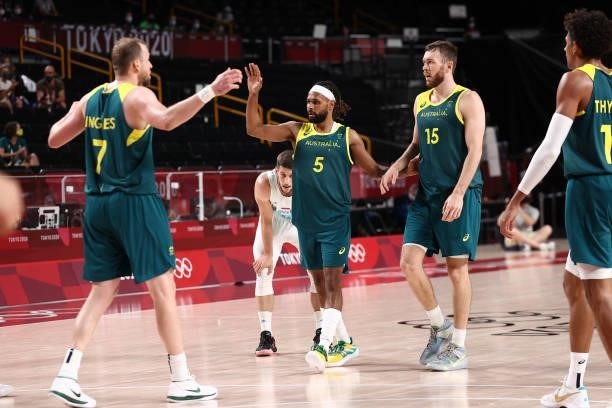 Patty Mills hi-fives Joe Ingles of the Australia Men's National Team during the game against the Slovenia Men's National Team during the Bronze Medal...