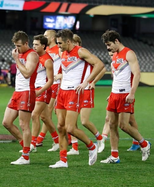 The Swans look dejected after a loss during the 2021 AFL Round 21 match between the St Kilda Saints and the Sydney Swans at Marvel Stadium on August...