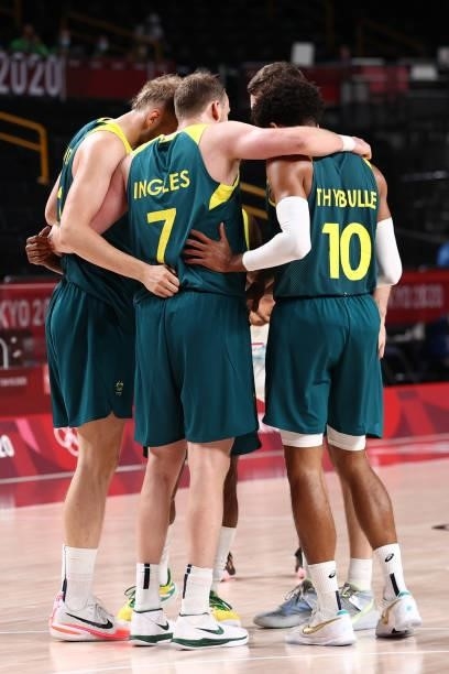 Joe Ingles and Matisse Thybulle of the Australia Men's National Team huddle with the team during the game against the Slovenia Men's National Team...