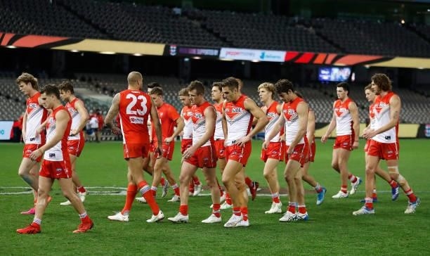 The Swans look dejected after a loss during the 2021 AFL Round 21 match between the St Kilda Saints and the Sydney Swans at Marvel Stadium on August...