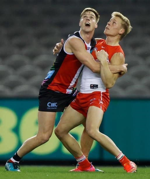Isaac Heeney of the Swans and Thomas Highmore of the Saints compete for the ball during the 2021 AFL Round 21 match between the St Kilda Saints and...