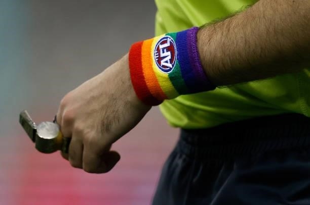 The umpires pride wristbands are seen during the 2021 AFL Round 21 match between the St Kilda Saints and the Sydney Swans at Marvel Stadium on August...