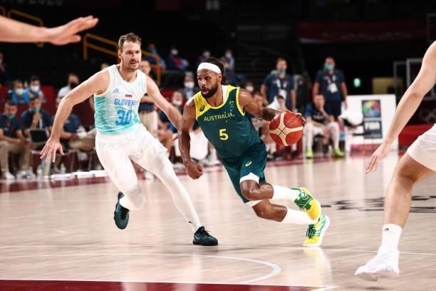 Patty Mills of the Australia Men's National Team dribbles the ball against the Slovenia Men's National Team during the Bronze Medal Game of the 2020...