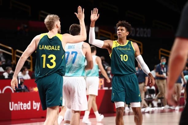 Jock Landale high fives teammate Matisse Thybulle of the Australia Men's National Team during the game against the Slovenia Men's National Team...