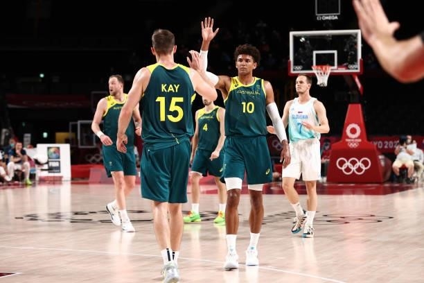 Nic Kay high fives teammate Matisse Thybulle of the Australia Men's National Team during the game against the Slovenia Men's National Team during the...