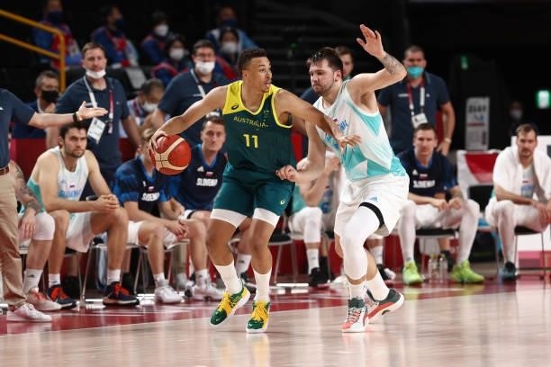 Luka Doncic of the Slovenia Men's National Team plays defense on Dante Exum of the Australia Men's National Team during the Bronze Medal Game of the...