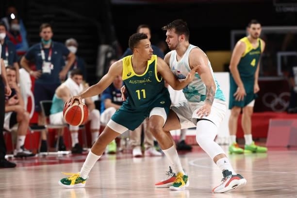 Luka Doncic of the Slovenia Men's National Team plays defense on Dante Exum of the Australia Men's National Team during the Bronze Medal Game of the...