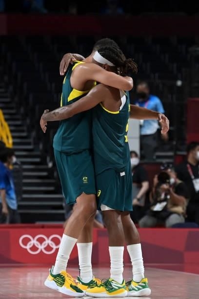 Australia's Patty Mills and Australia's Dante Exum embrace as they celebrate after their victory at the end of the men's bronze medal basketball...