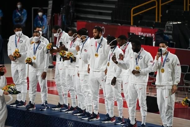 First placed USA's players stand in the podium with their gold medals during the medal ceremony for the men's basketball competition of the Tokyo...