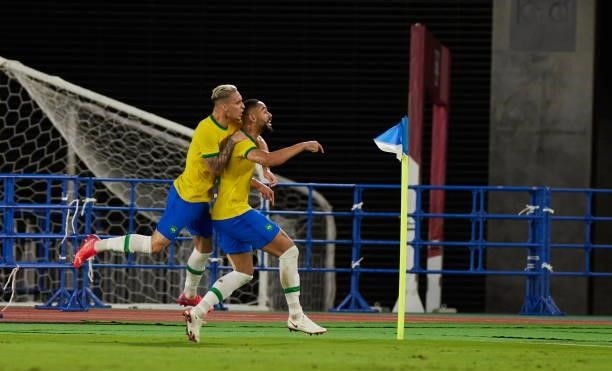 Antony of Brazil and Scorer Matheus Cunha of Brazil celebrates after scoring his teams goal with teammates during the Men's Gold Medal Match between...
