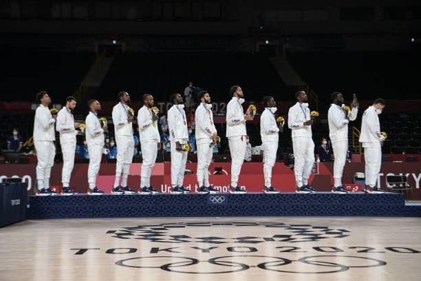 First placed USA's players listen to the anthem in the podium during the medal ceremony for the men's basketball competition of the Tokyo 2020...