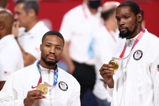 Damian Lillard and Kevin Durant of the USA Men's National Team pose for a photo after winning the Gold Medal Game of the 2020 Tokyo Olympics on...