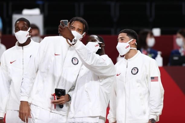 JaVale McGee, Draymond Green and Devin Booker of the USA Men's National Team pose for a photo after winning the Gold Medal Game of the 2020 Tokyo...