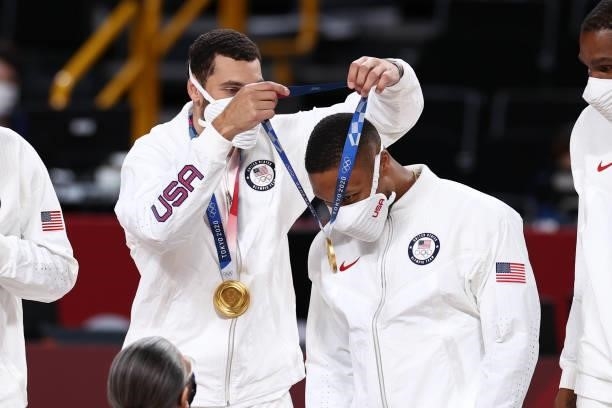 Zach LaVine presents Damian Lillard of the USA Men's National Team with the medal after winning the Gold Medal Game of the 2020 Tokyo Olympics on...