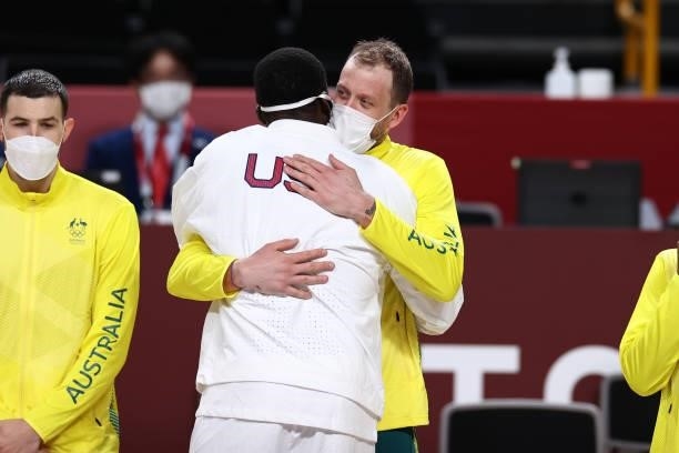 Joe Ingles of the Australia Men's National Team hugs Draymond Green of the USA Men's National Team during the Medal Ceremony of the 2020 Tokyo...