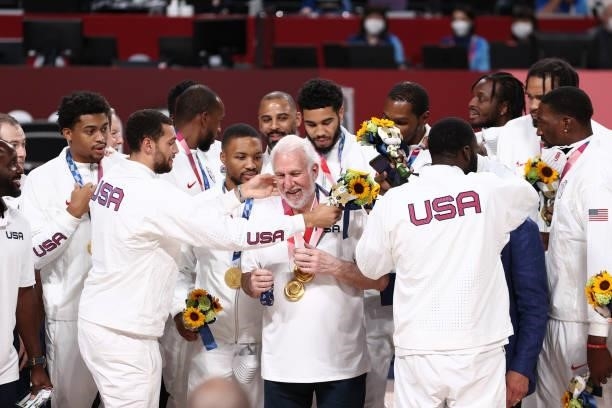 The USA Men's National Team present Head Coach Gregg Popovich with the gold medal after winning the Gold Medal Game of the 2020 Tokyo Olympics on...