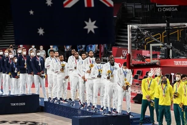 First placed USA's team stands in the podium with second placed France and third placed Australia during the medal ceremony for the men's basketball...