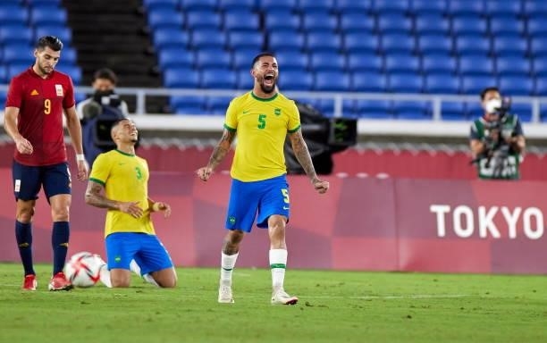 Douglas Luiz of Brazil and Diego Carlos of Brazil celebs after during the Men's Gold Medal Match between Brazil and Spain on day fifteen of the Tokyo...