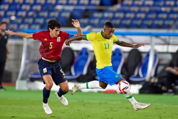 Malcom of Brazil and Jesus Vallejo of Spain battle for the ball during the Men's Gold Medal Match between Brazil and Spain on day fifteen of the...