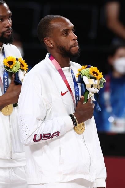 Khris Middleton of the USA Men's National Team stands for the national anthem after winning the Gold Medal Game of the 2020 Tokyo Olympics on August...