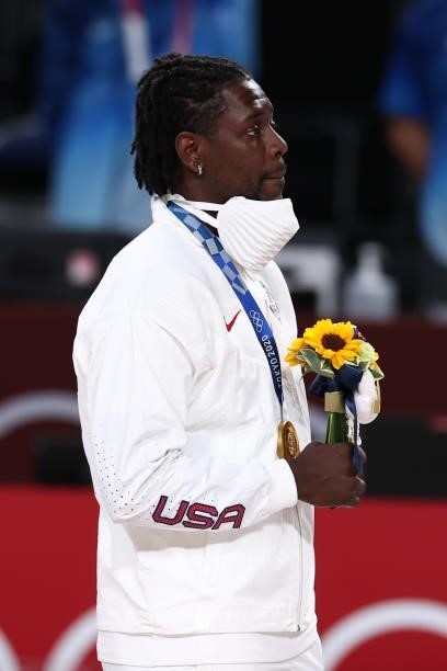 Jrue Holiday of the USA Men's National Team stands for the national anthem after winning the Gold Medal Game of the 2020 Tokyo Olympics on August 7,...