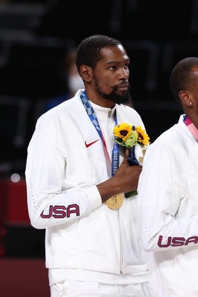 Kevin Durant of the USA Men's National Team stands for the national anthem after winning the Gold Medal Game of the 2020 Tokyo Olympics on August 7,...