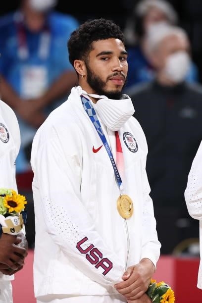Jayson Tatum of the USA Men's National Team stands for the national anthem after winning the Gold Medal Game of the 2020 Tokyo Olympics on August 7,...