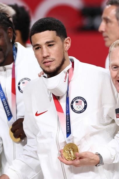 Devin Booker of the USA Men's National Team poses for a photo after winning the Gold Medal Game of the 2020 Tokyo Olympics on August 7, 2021 at the...