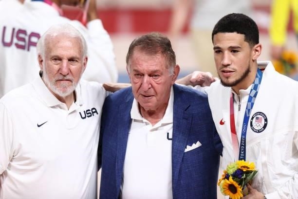 Managing Director, Jerry Colangelo of the USA Men's National Team poses for a photo with Head Coach, Gregg Popovich and Devin Booker after winning...