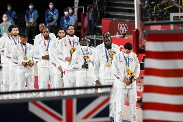 First placed USA's players stand in the podium during the medal ceremony for the men's basketball competition of the Tokyo 2020 Olympic Games at the...
