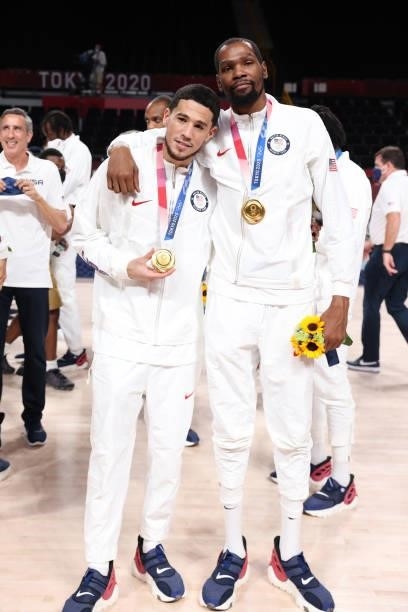 Devin Booker and Kevin Durant of the USA Men's National Team pose for a picture during the Medal Ceremony of the 2020 Tokyo Olympics at the Saitama...