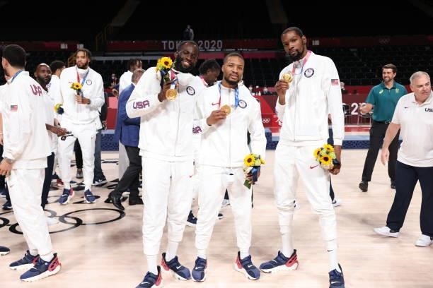 Draymond Green, Damian Lillard and Kevin Durant of the USA Men's National Team pose for a picture during the Medal Ceremony of the 2020 Tokyo...