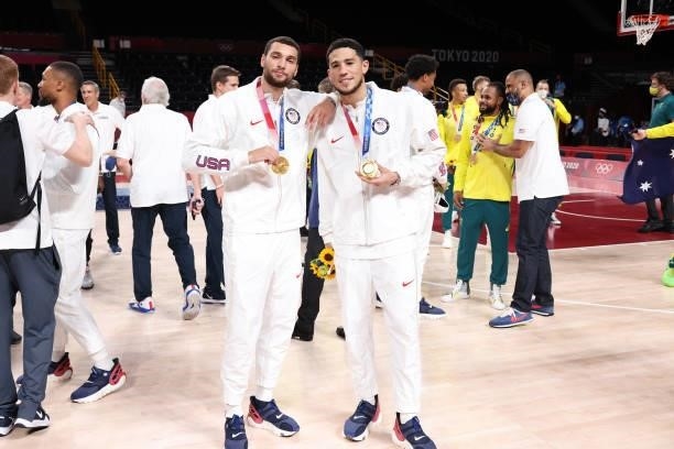 Zach LaVine and Devin Booker of the USA Men's National Team pose for a picture during the Medal Ceremony of the 2020 Tokyo Olympics at the Saitama...