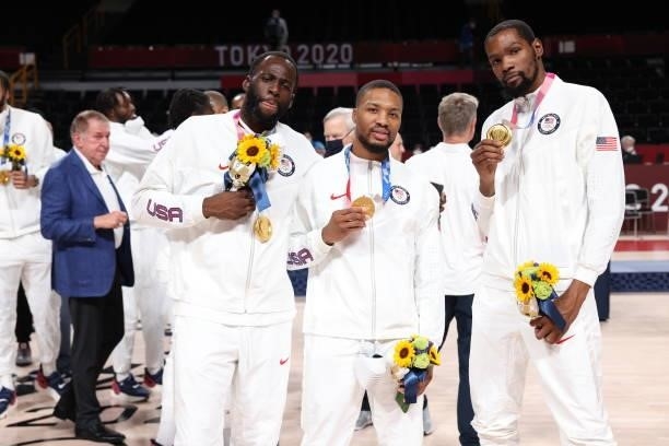 Draymond Green, Damian Lillard and Kevin Durant of the USA Men's National Team pose for a picture during the Medal Ceremony of the 2020 Tokyo...