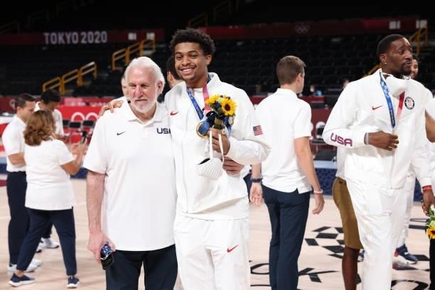 Head Coach Gregg Popovich of the USA Men's National Team and Keldon Johnson of the USA Men's National Team pose for a picture during the Medal...