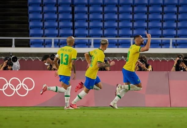 Dani Alves of Brazil, Antony of Brazil and Scorer Matheus Cunha of Brazil celebrates after scoring his teams goal during the Men's Gold Medal Match...