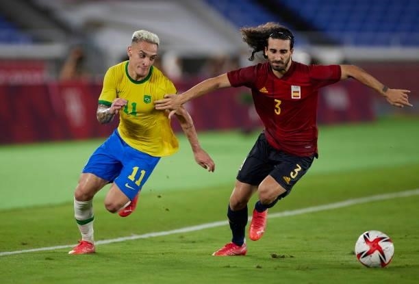 Antony of Brazil and Marc Cucurella of Spain battle for the ball during the Men's Gold Medal Match between Brazil and Spain on day fifteen of the...