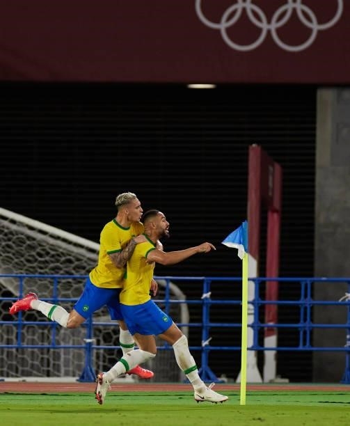 Antony of Brazil and Scorer Matheus Cunha of Brazil celebrates after scoring his teams goal during the Men's Gold Medal Match between Brazil and...