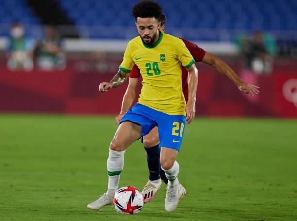Claudinho of Brazil battle for the ball during the Men's Gold Medal Match between Brazil and Spain on day fifteen of the Tokyo 2020 Olympic Games at...
