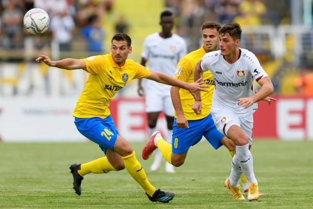 Luca Sirch of 1. FC Lokomotive Leipzig and Patrik Schick of Bayer 04 Leverkusen battle for the ball during the DFB Cup first round match between 1....