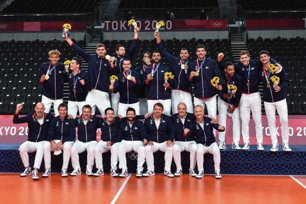 Team of France celebrates the victory with the gold medal on the podium during the Men's Final match between ROC and France at Ariake Arena on August...
