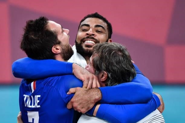 Earvin NGAPETH of France celebrates with Kevin TILLIE of France and Laurent TILLIE coach of France during the Men's Final match between ROC and...