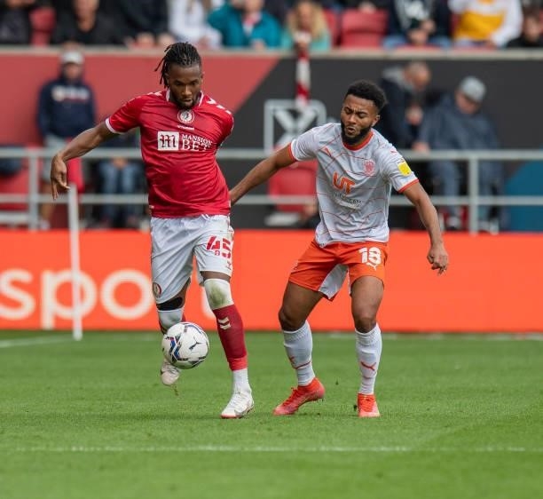 Bristol City's Kasey Palmer under pressure from Blackpool's Grant Ward during the Sky Bet Championship match between Bristol City and Blackpool at...