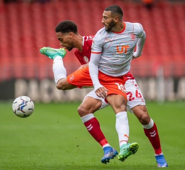 Blackpool's Keshi Anderson battles with Bristol City's Zak Vyner during the Sky Bet Championship match between Bristol City and Blackpool at Ashton...