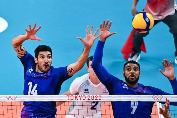 Nicolas LE GOFF of France and Earvin NGAPETH of France during the Men's Final match between ROC and France at Ariake Arena on August 7, 2021 in...
